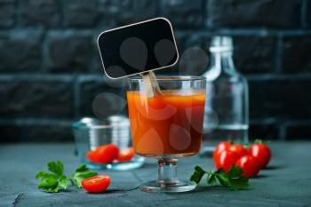 Cocktail Bloody-Mary in glass and on a table