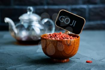 dry goji in bowl and on a table