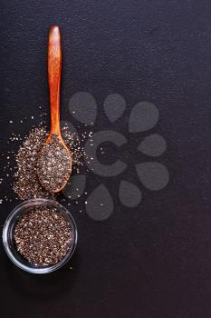 chia seeds on black table, raw chia seed