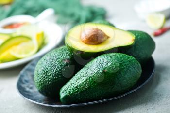 fresh avocado, lime and spice on a table