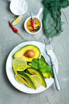 fresh avocado, lime and spice on a table