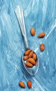 almond on a table, dry almond, nuts on wooden background