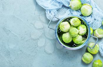 raw brussel sprouts on a table, fresh brussel sprouts