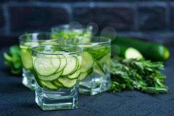 cucumber drink in glasses and on a table