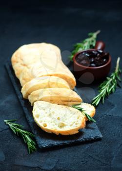 fresh bread with olives on a table