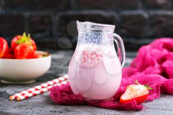 strawberry drink with milk in the jug
