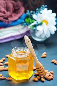 honey with nuts on a table, stock photo