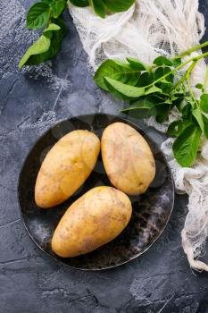raw potato on a table, stock photo