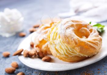 pastry rings with cream on the plate