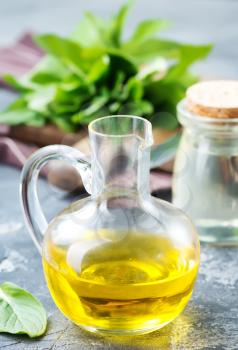 mint oil in bottle and on a table