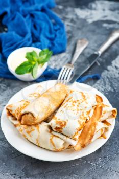 pancakes on plate and on a table