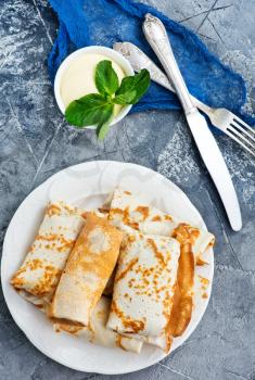 pancakes on plate and on a table