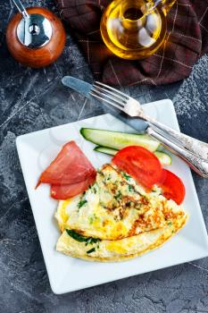 omelette with tomato on the white board