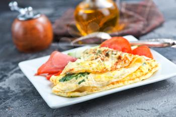 omelette with tomato on the white board