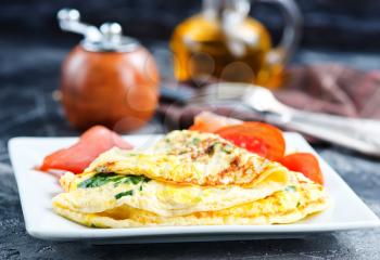 omelette with tomato on the white board