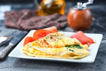 omelette with tomato on the white board