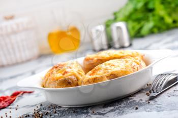 baked potato with bacon on the white plate