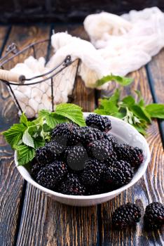 blackberry in the bowl and on a table