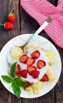 desert with cream and raspberry on the plate