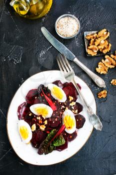 boiled beet with eggs on plate, beet salad