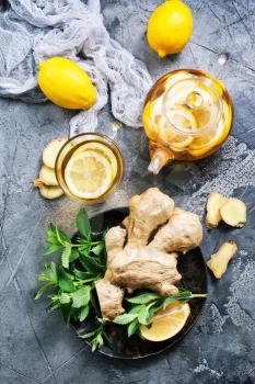 fresh ginger,herb and tea on a table