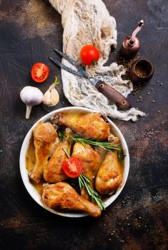 baked chicken legs with vegetables and spices