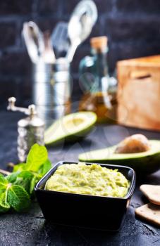 avocado sauce with lime in bowl, sauce in bowl