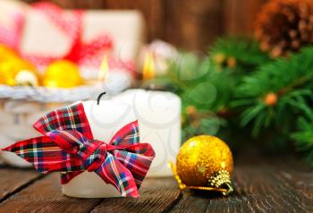 candles with ribbon on a table, christmas decoration