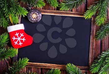 background from christmas tree on wooden background