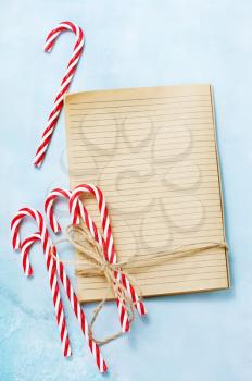 christmas background, book for recipe and candycanes