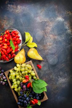 autumn fruits on a table, stock photo