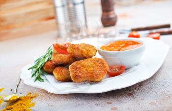 chicken nuggets with sauce, unhealthy food, stock photo