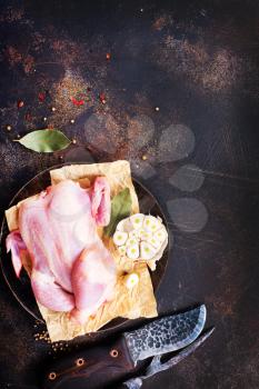 raw chicken with spice on a table