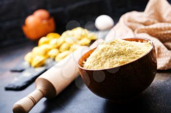 flour  in bowl and on a table