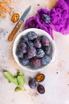 fresh plums on a table, stock photo