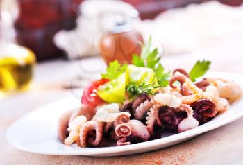salad with seafood on the plate, stock photo