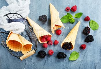 Berries and ice cream cone, stock photo