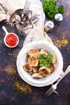 cutlets in bowl and on the table, stock photo
