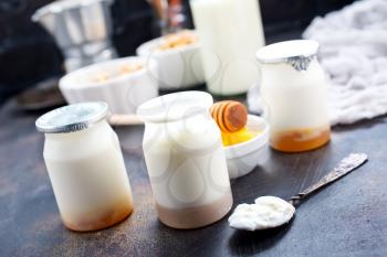 yogurt with granola on a table, stock photo