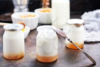 yogurt with granola on a table, stock photo