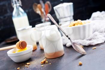 yogurt with granola on a table, stock photo