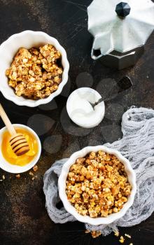 yogurt with granola on a table, stock photo