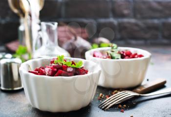 salad with boiled beet in the bowls