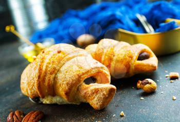 sweet croissant with chocolate and nuts, croissant for breakfast