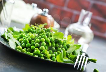 green peas on plate, fresh green peas, stock photo