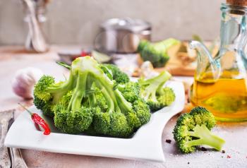 raw broccoli, diet food, raw broccoli on a table, stock photo