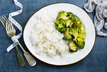 boiled white rice and broccoli on plate, diet food,stock photo