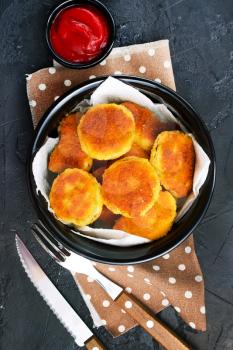 nuggets with tomato sauce on plate , stock photo