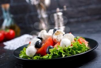 Vegetable salad on plate, greek salad, fresh salad with feta cheese