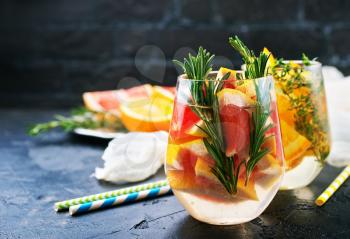 Grapefruit and rosemary gin cocktail, refreshing drink with ice.